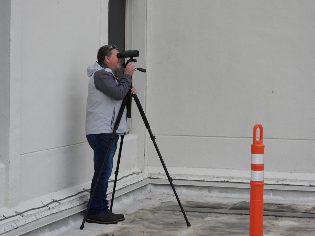 An engineer performing a facade inspection.
