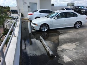 Water is ponding on the top floor of this parking structure.